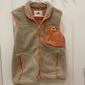 tan penfield vest with coral trim